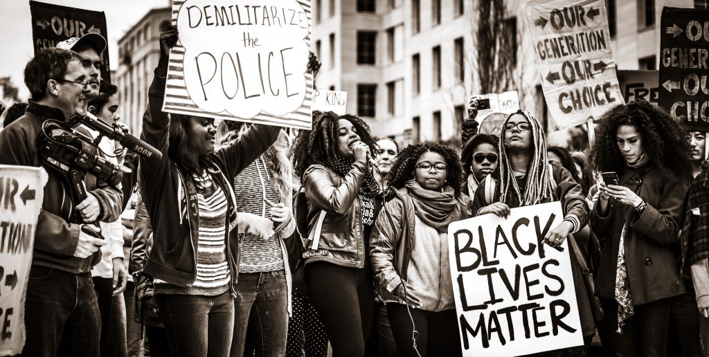<a title="Johnny Silvercloud, CC BY-SA 2.0 <https://creativecommons.org/licenses/by-sa/2.0>, via Wikimedia Commons" href="https://commons.wikimedia.org/wiki/File:Black_Lives_Matter_Protest.jpg"><img loading=
